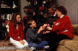 Family giving mother gift