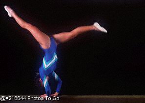 Girl on balance beam