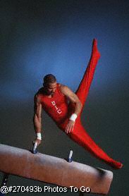 Gymnast performing routine on horse